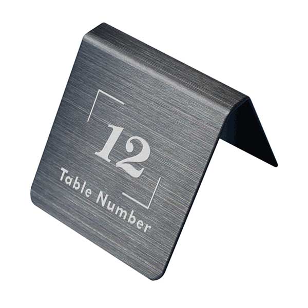 表札、プレートの納期について 当店の商品は全てオーダーメイドのため入金確認後2週間〜3週間程度いただいております。 表札やプレートによって、多少早く製作できる物もございます。 工期等の関係でお急ぎの場合は、納期をお知らせください。 出来る限りご対応させていただきますが、手作りのため最低限の製作時間は必要です。 アクリル製品は金属製品よりは比較的早めに仕上げることができ、表札の製作には少し時間がかかる物もございます。 金属加工は、ほんの少しの傷がついても修正ができず、一から作り直すしかありません。 そのため少し長い目の納期をいただいています。 余裕をもって早い目にご注文いただきたいと思います。 なにとぞご理解ください。 必ず納期に見合う、表札、プレートをお送りいたします。 表札工房あかり　店長上田テーブル、カウンター等に置くタイプのプレートです。 本体はステンレスを使用しています。 文字部分はエッチング加工（掘り込み加工）の本格的銘板のテーブルプレートです。 両面を同じデザインで仕上げています。ステンレスを特殊加工したプレートです。日陰では、黒く、光が当たると輝いてグレーっぽく見えたり、見る角度によって風合いを醸し出すステンレスプレートです。このプレートは、腐食後、加工が出来ない為、文字に色を入れることは出来ません。 オーダーメイド商品ですので文字の入れ替えも承っています。 【商品説明】 当店オリジナルデザインのテーブルプレートです。 【サイズ・素材・仕様】 製作納期／お客様原稿承認後2週間〜3週間 本体サイズ／横：45mm×縦：45mm×高さ：約40mm 文字・ピクト部／エッチング加工。 材質／ステンレス(SUS304)0.8mm 仕様／本体表面は全て耐久性に優れサビ難い素材ステンレス(SUS304)を使用しています。 オーダーメイド製品ですので、文字の入れ替えに対応しています。 必要テーブル数に合わせて、数字の連番で作成致します。 お買い物カゴ内の備考欄にご記入ください。 変更がない場合は、校正なしで製作に取り掛かります。 変更、追加等がある場合は、校正用データをメールにてお送りいたします。