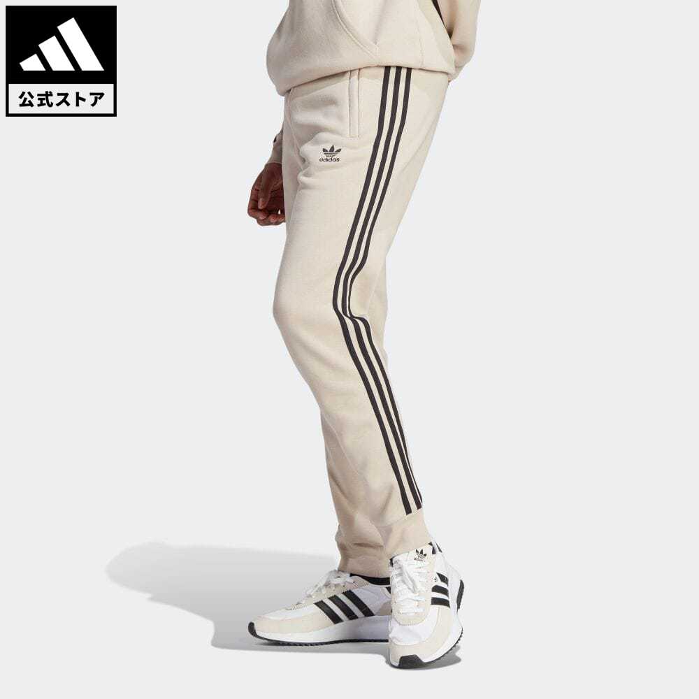 【公式】アディダス adidas 返品可 アディカラー クラシックス スリーストライプスパンツ オリジナルス メンズ ウェア 服 ボトムス ジャージ パンツ ベージュ IK9121 下