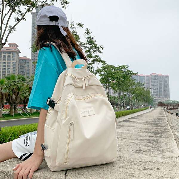 ロゴプレート 6ポケット付き シンプル バックパック リュック 鞄 かばん 大容量 ク...