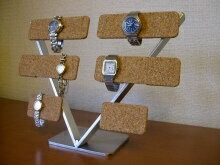 サイズ 長さ37cm、奥行き12cm、高さ27cm　バー5cm 材　質 ステンレス、コルクシート 色 ステンレス部分：シルバー色 商品説明 ◎ハンドメイドのステンレス製腕時計スタンドです。 ◎ステンレスは丁寧にヘアライン＆サテン仕上げを施し...