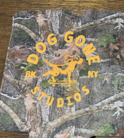 DogGoneStudios Circle Logo Camo Coozie