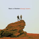 2016/3/11 発売輸入盤レーベル：NEW WEST RECORDS収録曲：New West Records is proud to present Strange Country, the new full-length album from the young and gifted cousin-duo Kacy & Clayton. The ten-song collection was recorded over seven freezing Canadian winter days at Ghetto Box Studios, a historic community hall turned studio. The product of a lifetime of deep kinship, the record showcases the purity and astounding beauty of Kacy Anderson's voice, one that has been notably compared to Fairport Convention's Sandy Denny. Only Clayton Linthicum's intricate guitar work, expert time changes and vocal harmonies could forge the foundation for Kacy's voice to soar even higher - the result being an enormously satisfying and organic album. Drawing a wide swath of inspirations ranging from the Greenwich Village folk scene to the ancestral music of Southern Appalachia and the British Isles, the duo fashions songs steeped in those traditions, simultaneously paying homage and building on those sounds.