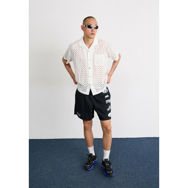 ナイキ メンズ カジュアルパンツ ボトムス CLUB FLOW CYCLE - Tracksuit bottoms - black/white