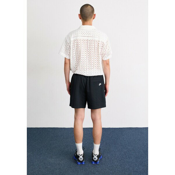 ナイキ メンズ カジュアルパンツ ボトムス CLUB FLOW CYCLE - Tracksuit bottoms - black/white