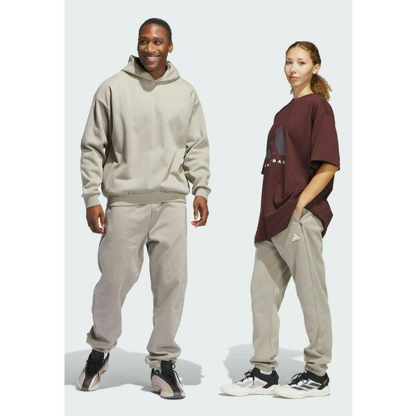 アディダス メンズ カジュアルパンツ ボトムス BASKETBALL JOGGERS NEUTRAL - Tracksuit bottoms - putty beige