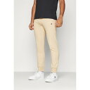チャンピオン メンズ バスケットボール スポーツ ICONS CUFF PANTS - Tracksuit bottoms - tan