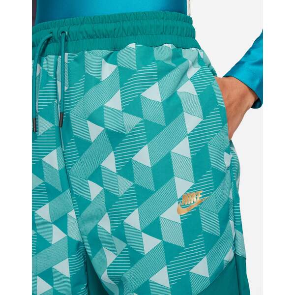 ナイキ レディース カジュアルパンツ ボトムス Nike X Serena Design woven geo print cuffed pants in teal Teal