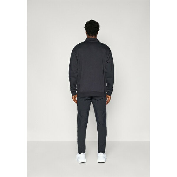 アンダーアーマー メンズ カジュアルパンツ ボトムス VANISH TAPERED PANTS - Tracksuit bottoms - black/castlerock