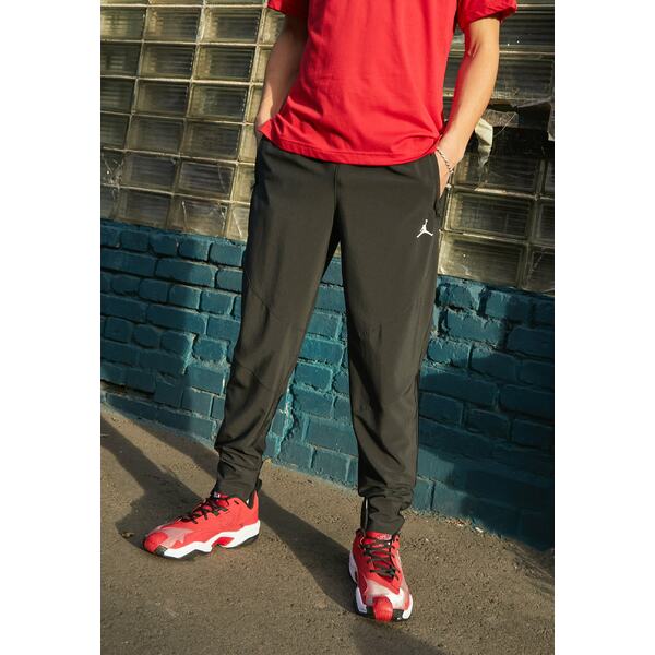 ジョーダン メンズ カジュアルパンツ ボトムス SPORT WOVEN PANT - Tracksuit bottoms - black/white