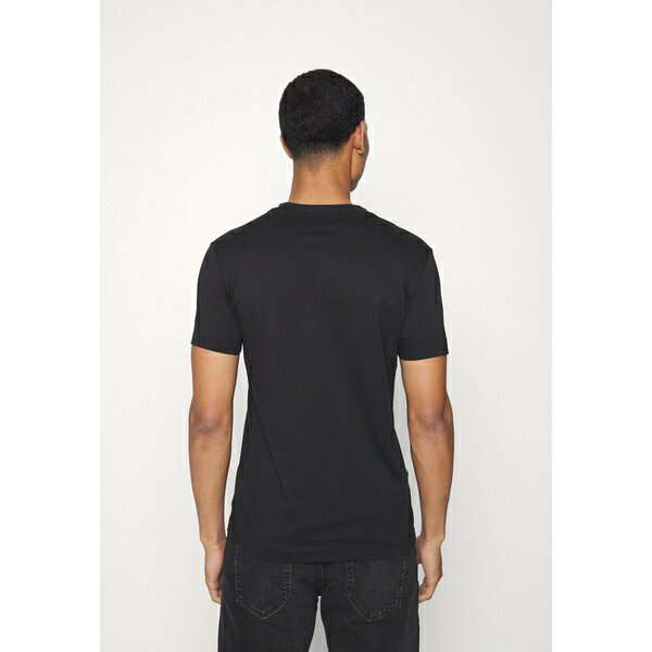 モデル カルバンクライン レディース Tシャツ トップス REPEAT LOGO TEE UNISEX - Print T-shirt - black：asty パからお