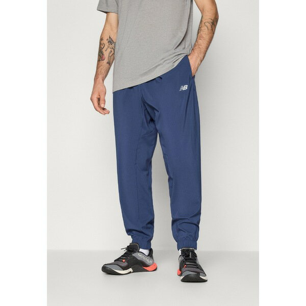 ニューバランス メンズ カジュアルパンツ ボトムス SPORT ESSENTIALS JOGGER - Tracksuit bottoms - navy