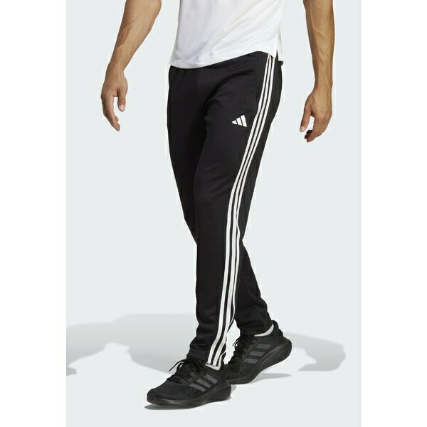 アディダス メンズ カジュアルパンツ ボトムス ESSENTIALS 3-STRIPES - Tracksuit bottoms - black/white