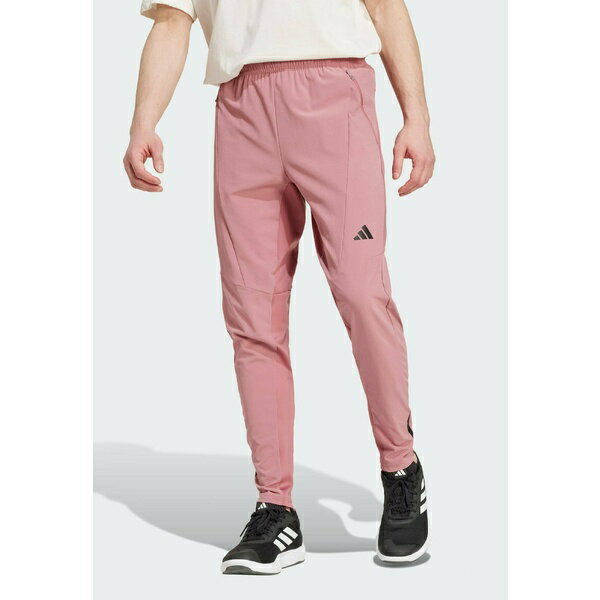 アディダス メンズ カジュアルパンツ ボトムス DESIGNED FOR HYBRID - Tracksuit bottoms - preloved crimson