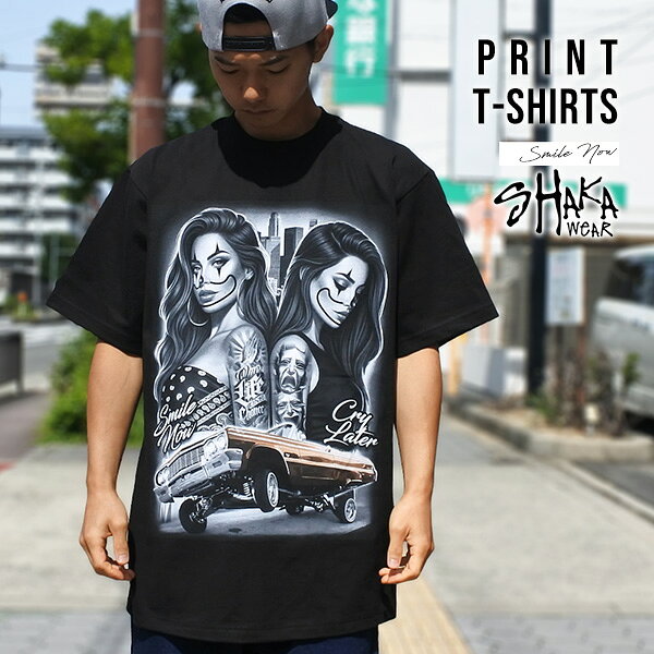 Tシャツ メンズ 半袖 SHAKA WEAR メンズ ブラック 1964 CHEVROLET IMPALA シボレー インパラ Smile now Cry later TWOFACE ツーフェイス ピエロ アメ車 オーバーサイズ おしゃれ トップス 黒 チカーノ チカーナ ウエストコースト ローライダー Lowrider 西海岸 アメリカ 雑貨