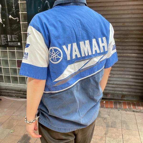 Buy Yohji Yamamoto men black x new era logo shorts for $305