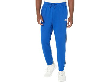 (取寄) アディダス メンズ adidas men Essentials 3-Stripes Tapered Cuff Fleece Pants Team Royal Blue/White