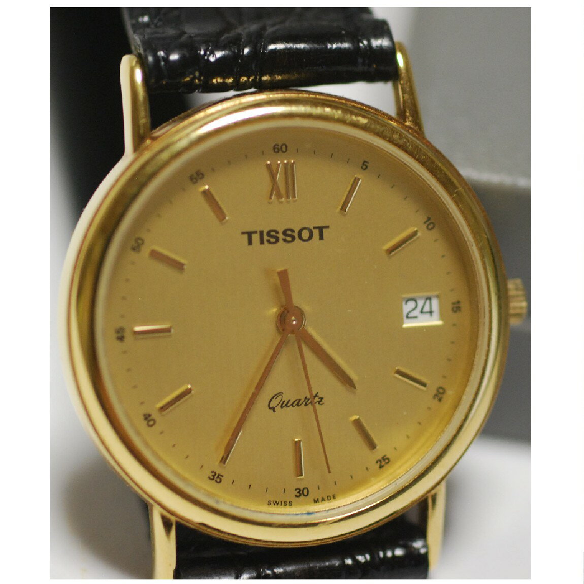 楽天質カラーズ【中古】本物完動美品TISSOTティソの紳士用光輝く金色薄いクオーツの30m防水時計　1か月保障付き　〇A16-79 T-2