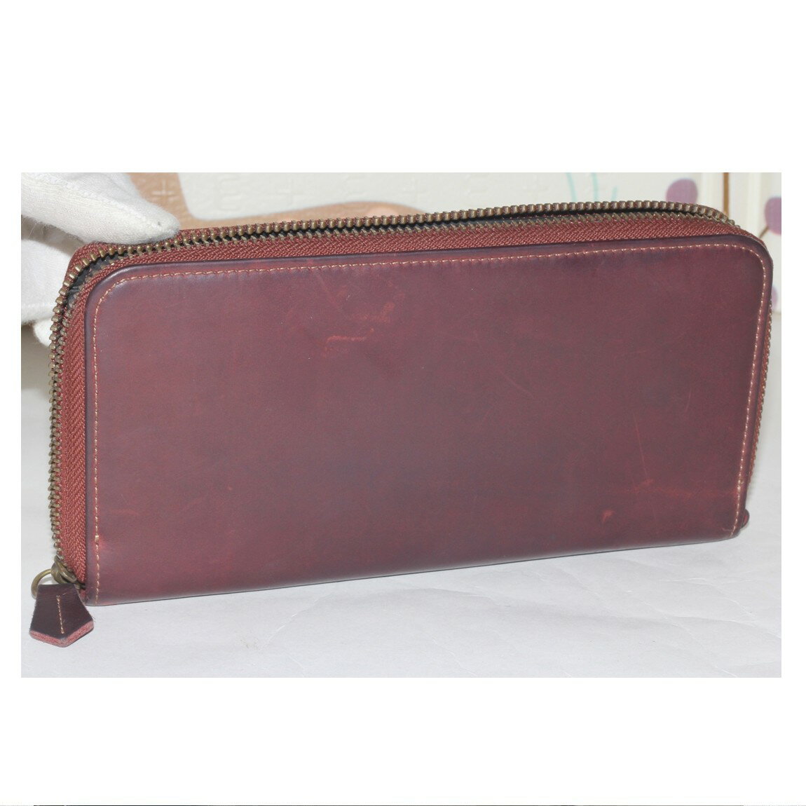 楽天質カラーズ【中古】本物可ココマイスターの紳士用赤みがかった焦げ茶色天然革素材のラウンドジップ長財布　サイズW19,5H10D2cm　〇C19-212-3　KA-10