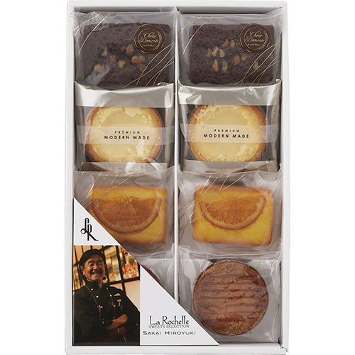 リーブルBチーズタルト、オレンジケーキ、チョコブラウニー、ガレットブルトンヌといったムッシュ坂井ならではのスイーツギフトセットです。セット内容 : チーズタルト・オレンジケーキ・チョコブラウニー・ガレットブルトンヌ×各2 賞味期限 : 常温3ヶ月 アレルゲン : 卵・乳・小麦・くるみ 箱サイズ : 30×19×5cm 箱入重量 : 0.4kg