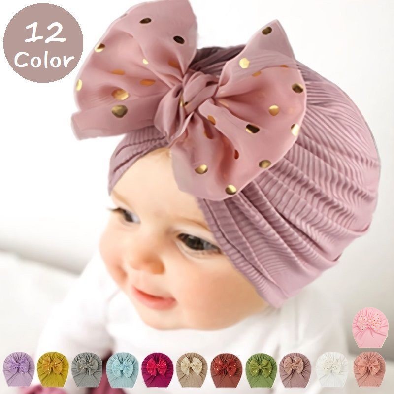 ドット柄のリボンが可愛さ満点♪ベビー用のターバン風帽子です。 【サイズについて】画像をご参照ください。 【カラーについて】生産ロットにより柄の出方や色の濃淡が異なる場合がございます。お使いのモニターや撮影時の光の加減などにより画像と実際の商品のカラーが異なる場合もございます。予告なしにカラーやデザインなどの変更がある場合もございます。 【素材について】綿