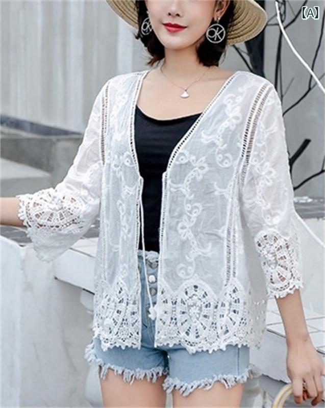 ショート丈 カーディガン 短い 服の 上着の 外に 日焼け防止の コートを 着ています。