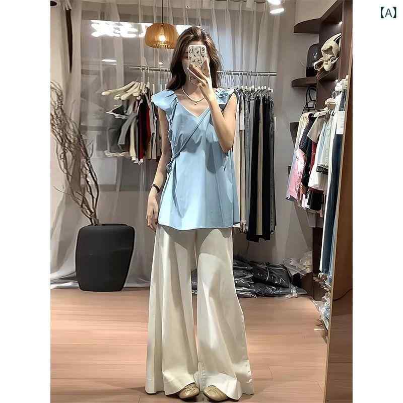 セットアップ レディース Vネック 夏の 服装は レディース フランス v ネックの 小さい 袖の シャツ高 腰の 広い 足を 合わせて カジュアル ズボンの スーツを 引きずっています。