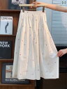 花柄ロングプリーツスカート フラワープリント 甘美な 白い 花の 半身の スカートの 女装の 夏の 新型の 小さい 背の 高さ 腰は やせている 中の 長い A 字の 大きい スカートを 現します。