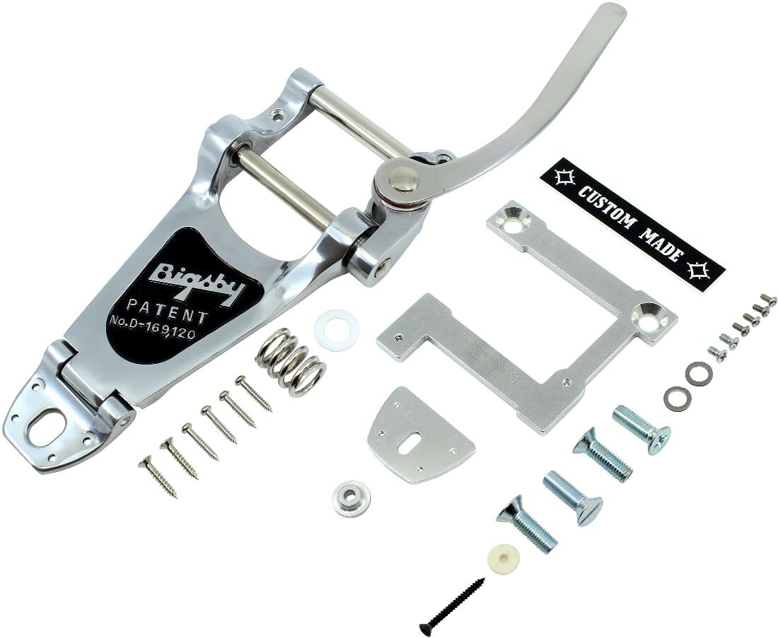 PRODUCT DETAILS Bigsby Vibramate B7 V7-335 ギター用 トレモロシステム 8.5インチ アーチトップ用 ES-335対応 シルバー【商品仕様】・ ブランド：Bigsby / Vibramate・ 型番：B7 / V7-335・ 品目：ギター用トレモロシステム・ 形状：8.5インチ アーチトップ用・ 対応モデル：ES-335タイプ等のストップテイルピースおよびチューン-O-マチックブリッジ搭載ギター・ カラー：シルバー・ 付属品：Bigsby B7本体、Vibramate V7マウントプレート（フェルトパッド付）、テールピースプレート、CUSTOM MADEネームプレートカバー（粘着式）、取付ネジ、スプリング、プラスチックワッシャー、アーム一式【特徴】・ Bigsby B7とVibramate V7-335がセットになっており、ギター本体に加工を施さずボルトオンで取り付けが可能です。・ マウントプレートの底面にはフェルトパッドが貼られており、ギターのトップ面を保護しながら装着できます。・ 伝統的な外観を再現するための「CUSTOM MADE」ネームプレートカバーが付属し、取り付け後のルックスを補完します。【ご注意】・ 取り付けには加工・配線作業が必要な場合があります。お手持ちの楽器との適合（弦数・サイズ・取付穴位置）をご確認のうえご注文ください。・ アクティブタイプのピックアップは9V電池が必要です（電池は付属しない場合があります）。 ■ 商品について 海外輸入品（説明書は英語表記の場合あり） ■ ご注意 ・掲載画像は実物に近い色味になるよう調整しておりますが、ご利用の環境により差異が生じる場合があります。・複数店舗で在庫を共有しているため、ご注文後に在庫切れとなる場合がございます。 ■ 納期について お届けの目安を必ずご確認ください。 海外正規ルート仕入れ品 海外ブランド ▼ 海外正規ブランド店 正規代理店 ▼ 当 店 ※本商品は並行輸入品です 製造元は正規品と同一のブランド・メーカーです。当店では海外正規ルートより仕入れた商品を取り扱っております。流通ルートが異なるのみで、商品自体に違いはございません。 ── 当店の商品について ── 正規品のみ取り扱い 海外正規店・正規代理店から商品を直接仕入れ、国内に輸入して販売しております。 日本未入荷・海外限定モデルも多数 日本未入荷・海外限定モデルも多数取り扱っております。サイズ・カラー違いや海外限定で販売された製品など、日本では手に入りにくいアイテムをお届けいたします。 お求めやすい価格の理由 海外市場での価格差や流通ルートの違いにより、国内販売価格よりお求めやすくなっております。品質はそのままに、よりお手頃な価格でお届けいたします。 安心保証 ご使用前に万が一、製品に不具合がございました場合は、交換または商品代金のご返金にて対応させていただきます。商品到着後5日以内にご連絡ください。 ご注意 海外からの輸入品となります。海外輸送のため、外箱に軽微なスレ等がある場合がございますが、商品本体には影響ございません。 ※在庫状況は仕入先の在庫情報をもとに出来る限り正確に表示しておりますが、取寄せ商品のため、タイミングによりご注文後に欠品・キャンセルとなる場合がございます。 お探しの商品がございましたら、お気軽にご相談ください。