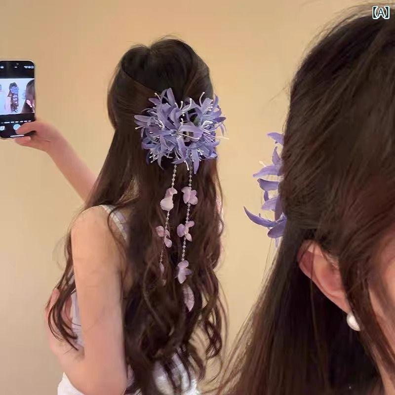純粋な 紫の 花の フリンジは 女性の 休暇の 風の サメを 挟んで 後頭部の 髪を 巻...