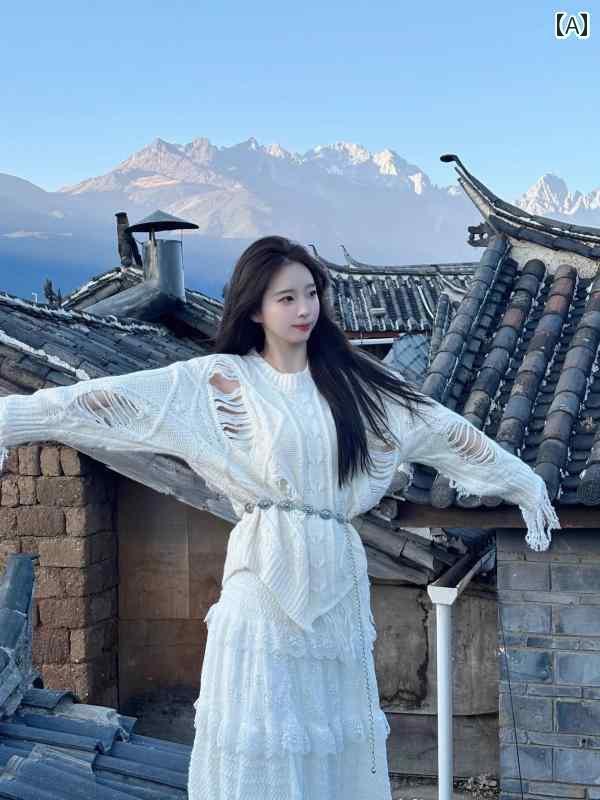 レディース ドレス おしゃれ 大理で撮った新疆民族風の写真を撮るに.エアースーツを着た女性が羊毛のセーターをまとい.撮影をする様子。春先向けコーディネート完成。