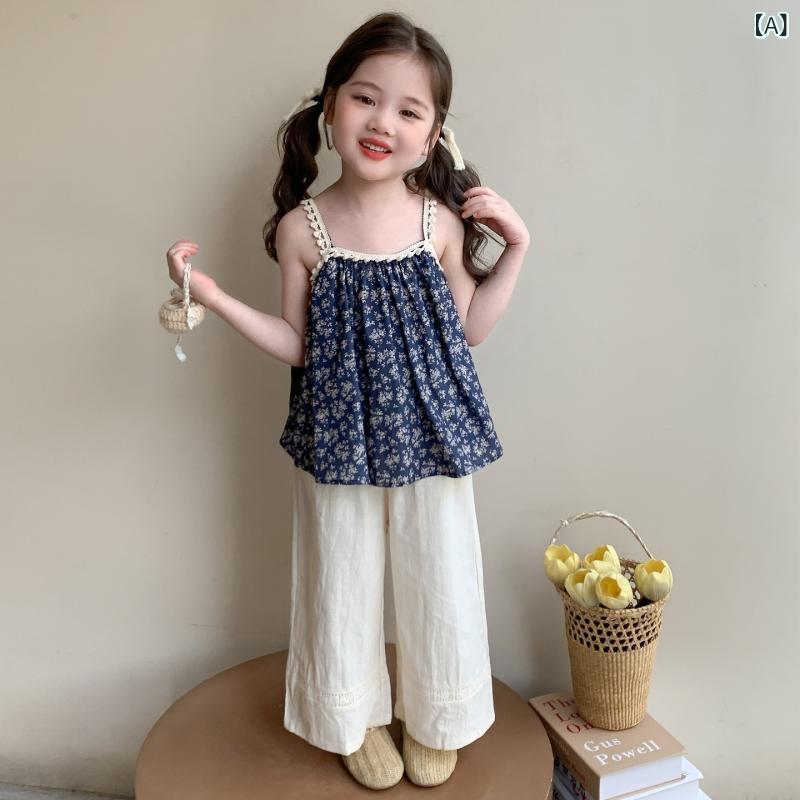 bloomelierのセットアップ ガールズ 女の子 子供服 ブルー 青 小花柄 フラワー キャミソール ストラップ ワイドパンツ ガウチョパンツ 2点セット おしゃれ かわいい ナチュラル カジュアル 普段使い お出かけ 春夏 綿 コットン｜アングル2