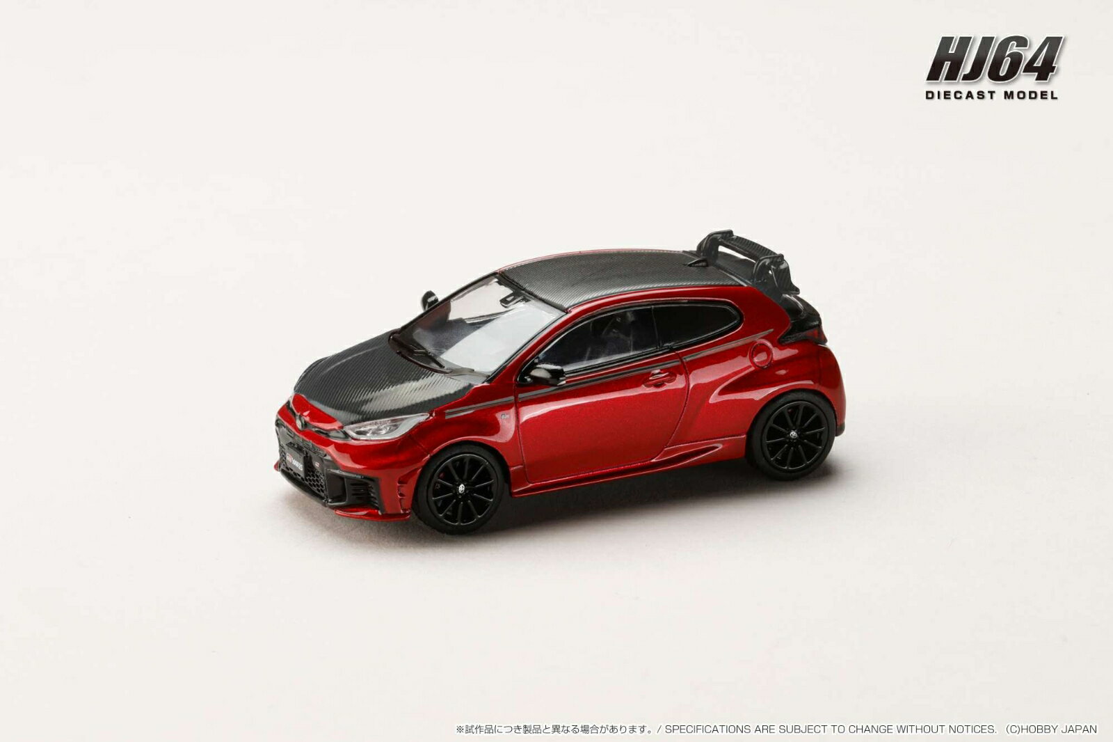 ホビージャパンの1/64ダイキャストシリーズ"HJ64"から1/64 トヨタ GR ヤリス RZ ハイパフォーマンス 2024 / カスタムバージョンの登場です。 
カスタムルーフスポイラーとカーボンボンネット、GRサイドストライプデカール装着車です。
製品にはクリアケースと台座が付属しますのでコレクションに最適です。

■素材：ダイキャスト(亜鉛合金）/ABS/
■写真はプロトタイプです。実際の製品とは異なります。
■仕様は予告なく変更になる場合がございます。　■ライセンス申請中。

※メーカー都合により大幅な発売延期や発売中止が発生する場合がございます。予めご了承ください。

・ホビー系商品についての諸注意
メーカー都合により発売の大幅な延期が発生する可能性がございます。
予約商品についてはメーカーから順次入荷次第の発送となります。メーカー公表の発売日とは異なる場合がございますのでご了承ください。【対象年齢】：【商品サイズ (cm)】(幅×高さ×奥行）：12×5×6