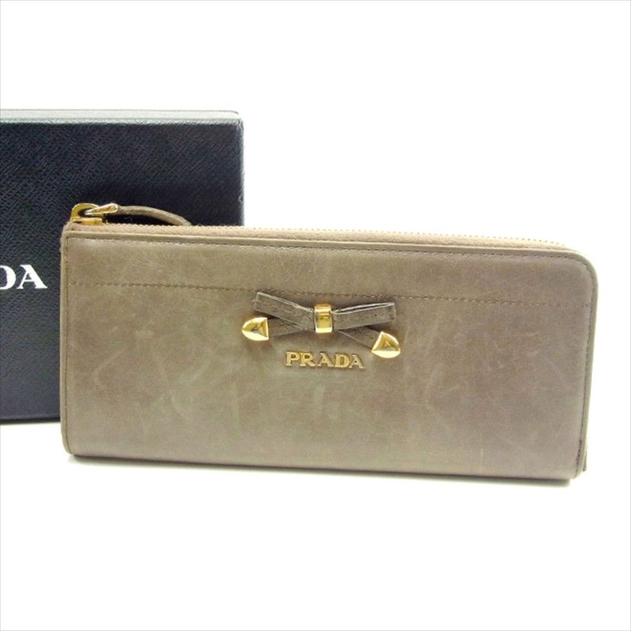 【スプリングセール30％OFF】プラダ 長財布 L字ファスナー リボンモチーフ ベージュ レザー PRADA 【プラダ】 t4607s 【中古】