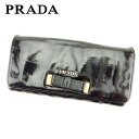 【春の大感謝祭 30％OFF】プラダ 長財布 ファスナー付き 財布 リボンモチーフ ブラック ゴールド レザー PRADA 【プラダ】 F1332S 【中古】