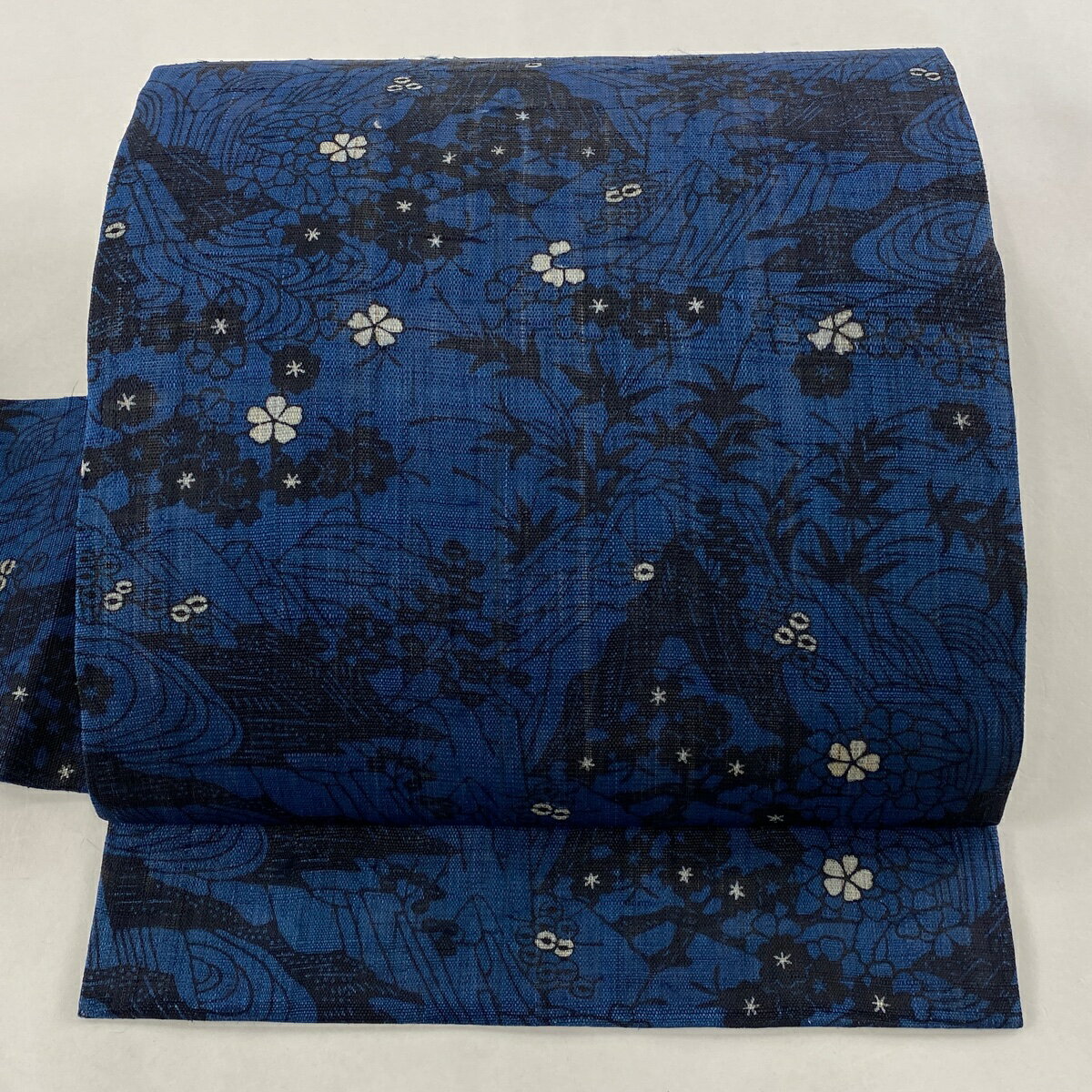 名古屋帯 美品 逸品 落款あり 城間栄順 草花 流水 藍色 正絹 【中古】のサムネイル