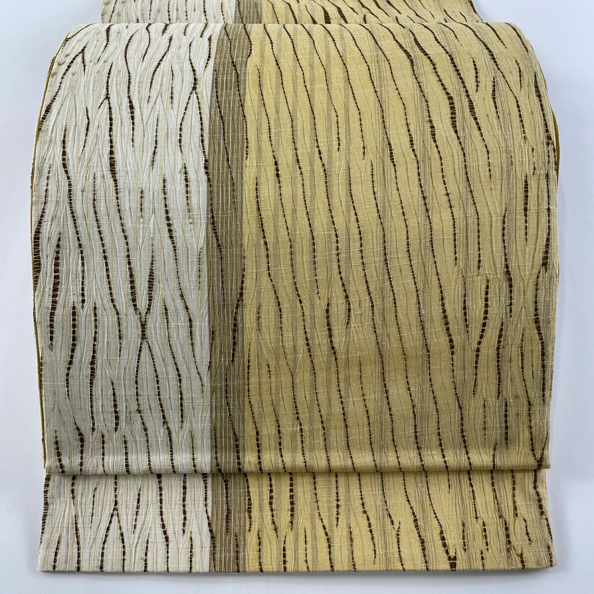 袋帯 名品 紬地 幾何学模様 絞り ベージュ 全通 正絹 【中古】のサムネイル