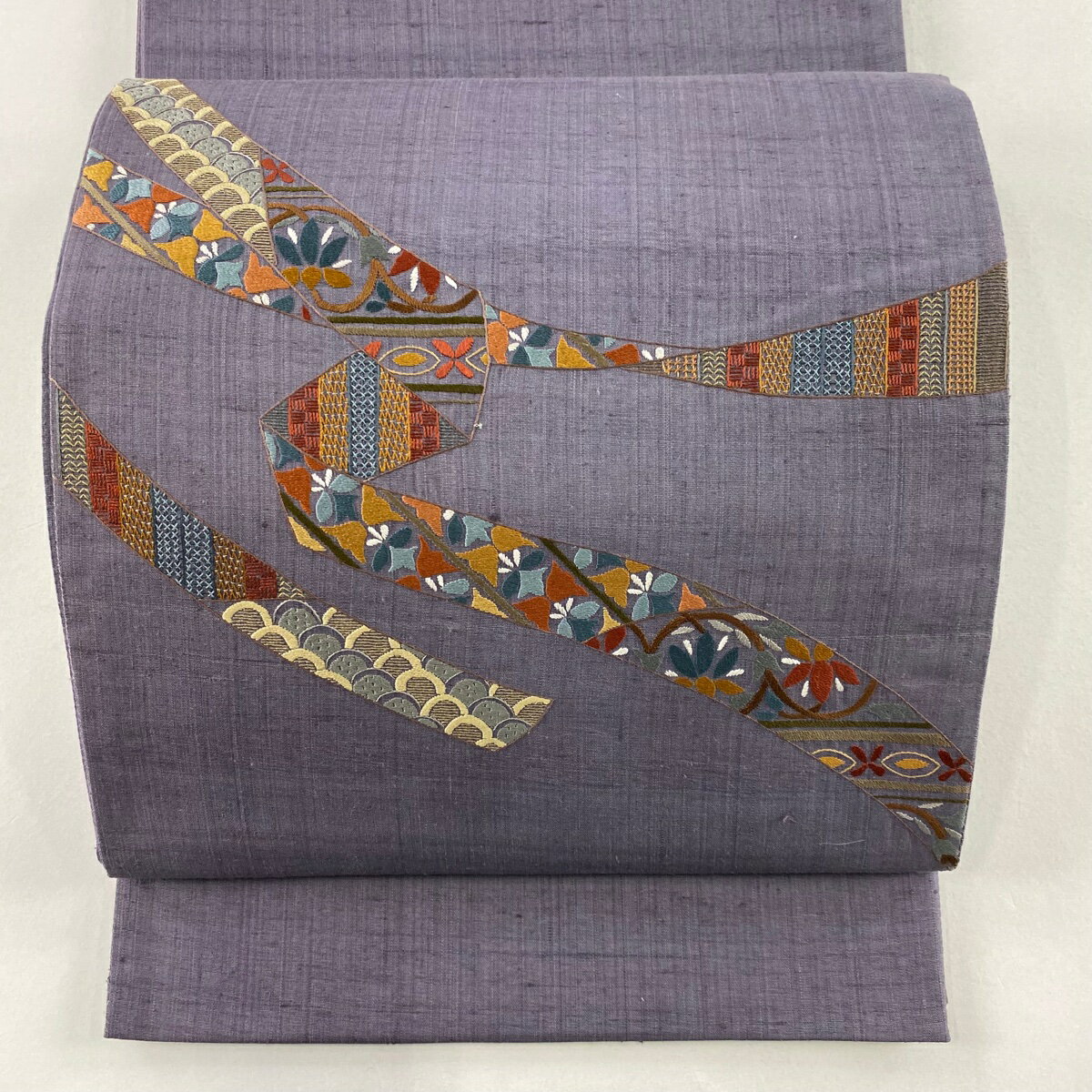 袋帯 秀品 紬地 蔓帯 草花 刺繍 紫 お太鼓柄 正絹 【中古】