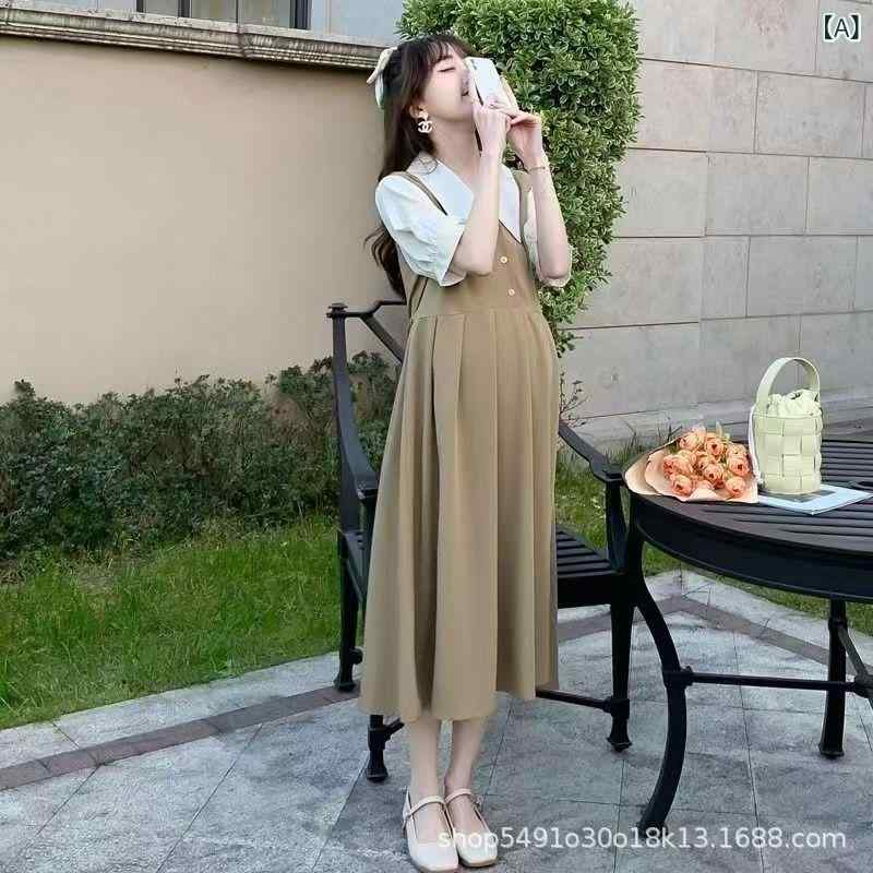 妊婦 服の 夏 ふり 洋風の 年齢 縮めた ロング スカートが ゆったり いて やせているお 母さんの スカート 夏 妊婦の ワンピースが 見えます