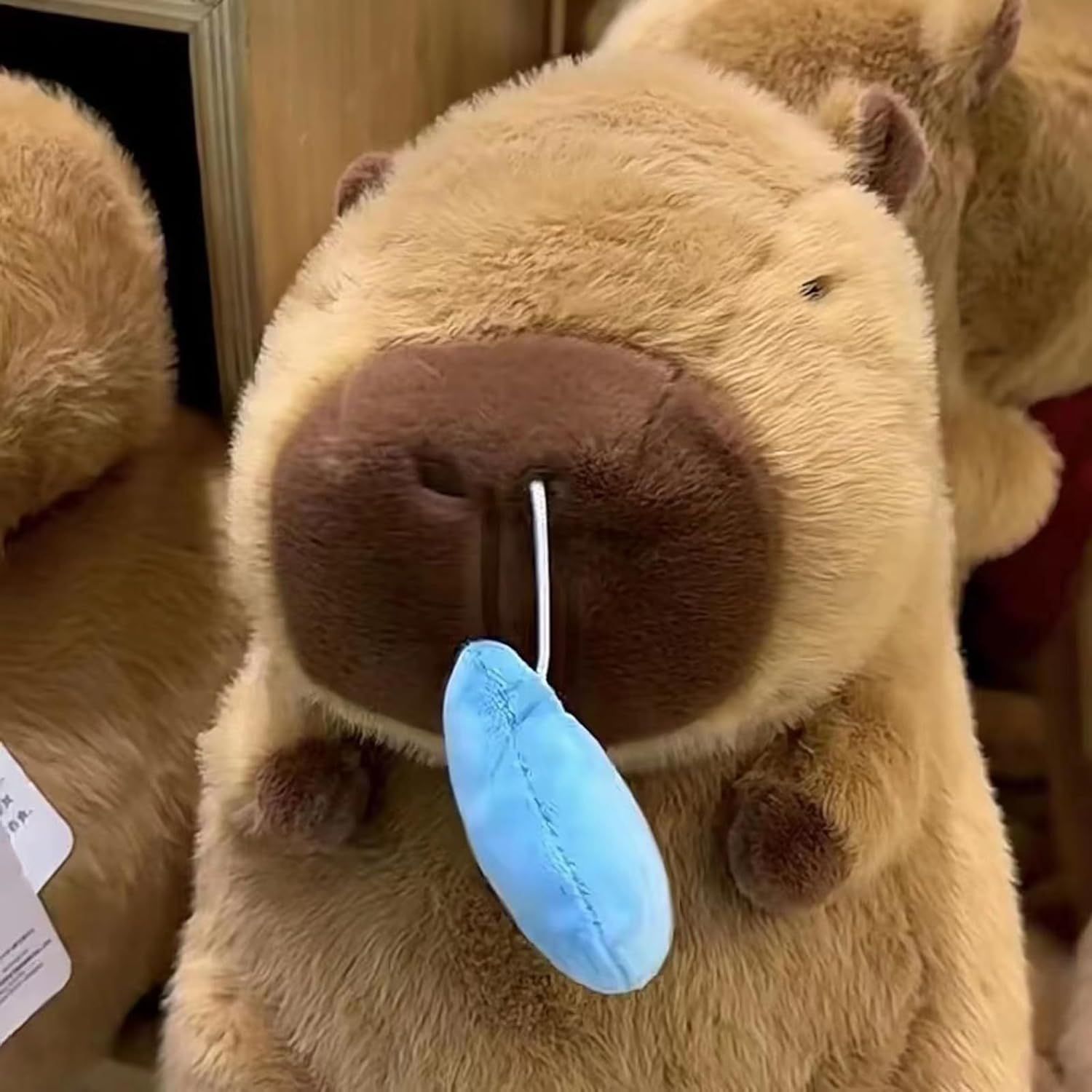 鼻の高いカピバラぬいぐるみ、鼻水カピバラぬいぐるみ、引っ張って使えるカピバラぬいぐるみ、漫画カピバラぬいぐるみフィギュア、柔らかい質感、カピバラ愛好家&家の装飾用