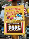 トッツィロール エンボスティンサイン (The World May Never Know) 看板 アメリカン雑貨 アメリカ雑貨 グッズ