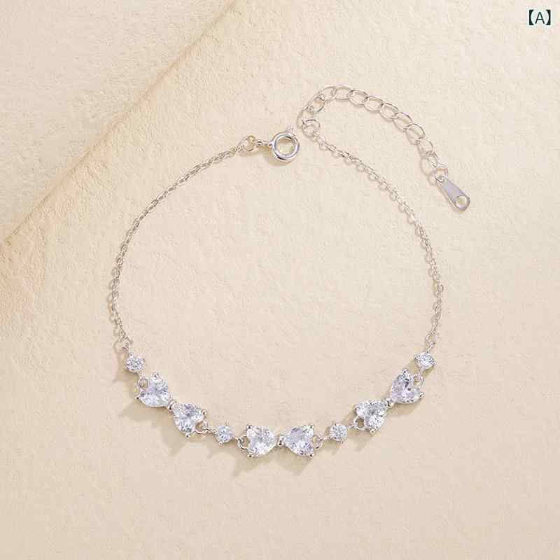 ブレスレット レディース 純銀 蝶結び ジルコニア 付き 高級感 ベーシック コーデ 気質 ニッチ 手アクセサリー 軽やか デザイン 女性用 銀細工 アクセント ジュエリー 日常使い 華やか さりげない 輝き 繊細 モダン シンプル 洗練 トレンド 個性