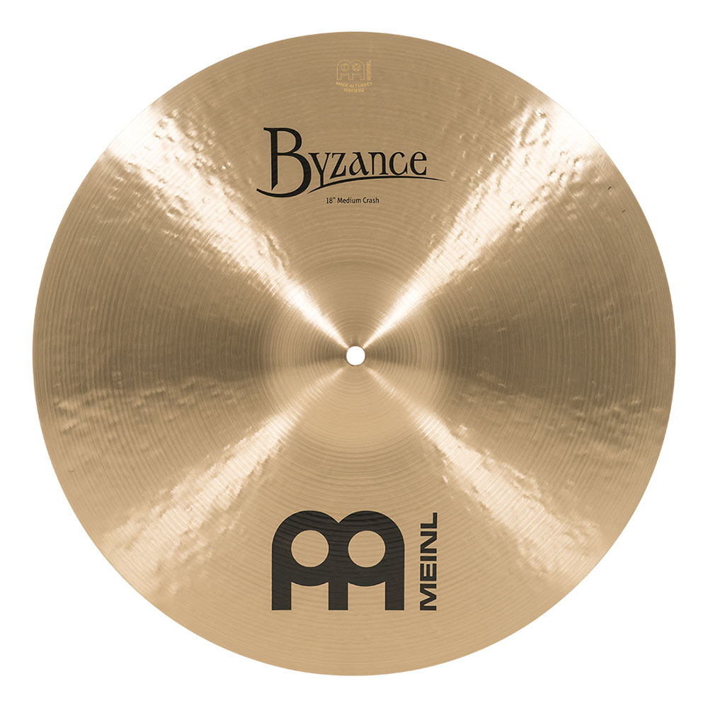 MEINL B18MC Crashes Byzance Traditional series 18" クラッシュシンバル【Byzance Traditional シリーズ】両面全体をレイジング(音溝)加工しています。そのサウンドは温かみがあり、なめらかでリッチ。スタジオスタンダードともいえる不動の定番シリーズがこのトラディショナルです。アイテムによって、Thin、Medium Thin、Medium、Heavyの設定が有り、ウエイトのバリエーションが最も多く選択の範囲が広いのも特徴です。BYZANCE全体での比較では、他のシリーズよりウエイトがしっかりと有り、ターキッシュシンバルならではの深みあるダークな倍音とともに、綺麗なトーンとサステインが広がります。18”ミディアムクラッシュは音量、トーン、アタックともにバランスが取れた、クラッシュ・シンバルの大定番品です。幅広いジャンルの音楽にマッチする汎用性の高いモデルです。特徴・B20ブロンズ合金製・ハンドハンマー加工による優れたサウンド・伝統的かつ個性的音楽ジャンルオルタネイティブ | カントリー | ハードロックヘヴィメタル | ポップス | パンク | R&Bロック | スタジオ音楽サイズ 18インチ