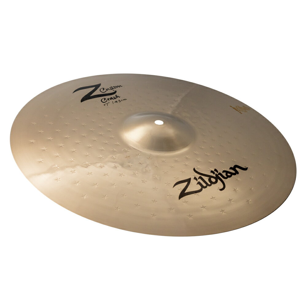 ZILDJIAN ジルジャン Z Custom 17" Crash Z40114 クラッシュシンバル1993 年に登場し、2009 年に生産完了となった Z カスタム(Z Custom)シリーズ。このたび、15 年の時を経て、多くの復活リクエストが寄せられていたこのシリーズがジルジャンラインナップに。Z カスタムは、世界的な人気の高まりを見せているメタルに最適なシリーズです。新たに生まれ変わった Z カスタムシリーズは、製造工程を見直すことで、耐久性、音楽性、演奏性が向上しました。ドラマーが長年求めてきた爆発的で明るく、大音量のサウンドを実現します。ブリリアントフィニッシュが施されたシンバルの表面には、オリジナルの Z シリーズを彷彿とさせるスターハンマーパターンが採用されています。Z カスタムの突き抜けるようなサウンドは、ステージやスタジオで無限の音楽表現を可能にします。・ジルジャンシンバルの中で最も復活リクエストが多かったシリーズ・明るく切れのある爆発的なサウンド・音色や音楽性を犠牲にすることなく、圧倒的な音の広がりを実現・向上した耐久性、音楽性、演奏性・材質:キャスト(B20 ブロンズ)あらゆるドラムキットに比類なきパワーとエネルギーをもたらすハードヒッティングドラマーのためのクラッシュ。明るさ、パワー、音量を高いレベルで発揮します。品名：Z40114仕様(ウェイト)：Mediumクラッシュサイズ：17インチ