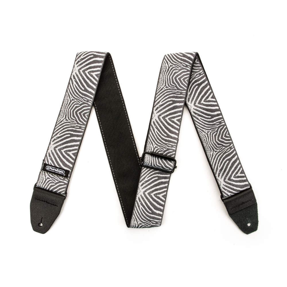 JIM DUNLOP ジムダンロップ D67-22 Designer Jacquard Straps ZEBRA CADABRA ギターストラップジャカード織りによるストラップです。フック部はレザー。■ 快適で高品質なジャカード織りのストラップ■ ダンロップ専属アーティストがデザインしたアニマル柄■ 200ポンド（約100kg）の引張試験をクリアした、本革製ストラップエンド■ 北米製長さ：Min 37"（約94cm） / Max 65"（約165cm）デザイン：ZEBRA CADABRA
