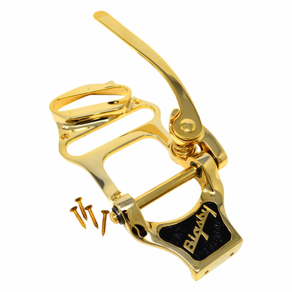 BIGSBY ビグスビー B16G Vibrato Tailpiece Gold with Bridge & Neck Shim ヴィブラート トレモロユニット※パーツの取り扱いには、相応の技術と知識が必要になります。自己責任にて取り扱い可能な方のみ、ご検討下さい。取り付け時に起った、楽器及びパーツの破損・損傷等につきましては当店は保証出来ません。あらかじめご了承下さい。Bigsbyを搭載したギターは、真のBigsbyヴィブラートだけが生み出せる表現力豊かで滑らかなサウンドを提供します。比類なき性能とヴィンテージスタイルを求めるギタリストにとって定番の選択肢であるBigsbyヴィブラートは、滑らかで正確なピッチ変化を実現し、繊細なヴィブラート効果を演出します。そのクラシックな外観と簡単な取り付け構造により、ギタリストにもルシアーにも人気です。Bigsbyサウンドを体感し、あなたのプレイを次のレベルへと引き上げましょう。B16は1953年に初めて導入され、特にTelecaster向けに作られています。典型的なBigsbyよりも広いレンジを持ち、フローティングブリッジとブリッジピックアップがアッセンブリ内に組み込まれているため、Telecasterに独特の外観とフィールを与えます。このヴィブラートは、巻き弦3弦用に調整されたアルミ製Sorkinフローティングブリッジを搭載しており、プレーンな3弦用ブリッジやサドルも選べます。付属のアルミ製ネックシムは、浮動式ブリッジとネックがうまく機能するための完璧な高さ（3/16インチ）とピッチ角度を提供します。・シリーズ：Bigsby Vibratos・原産国：US・カラー：Gold
