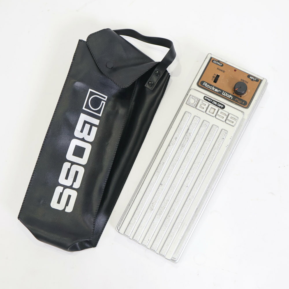 【中古】 ワウペダル BOSS PW-1 Rocker WahBOSS PW-1 Rocker Wah の中古品です。使用感のあるコンディションです。商品内容：本体・ソフトケース全体的に傷やスレ、塗装剝がれ、取り除けない汚れがあります。底面にテープ跡があります。前面のゴム足が若干外れかけています電池駆動、アダプター駆動確認済み。アダプターはACAアダプターのみ使用可です。PSAアダプターはご使用頂けません。現在の所、ガリもなく動作に問題ございません。MADE IN JAPAN（日本製）1980年代に製造されたBOSSのロッカーシリーズ・ワウペダル「PW-1 Rocker Wah」です。堅牢なダイキャストボディを採用したBOSSならではの耐久性と、踏み心地の良さが特徴的なモデルです。現在の多機能なデジタルワウとは一線を画す、アナログ回路特有の太く温かみのあるワウ・サウンドを出力します。ペダルの可変域が絶妙にチューニングされており、カッティングプレイからリードソロのトーンコントロールまで、プレイヤーの足元のニュアンスを忠実に表現します。現在では生産完了となっており、1980年代の「MADE IN JAPAN（日本製）」期のエフェクターとして、実用機としてはもちろん、ヴィンテージペダルとしても根強い人気を誇る一台です。