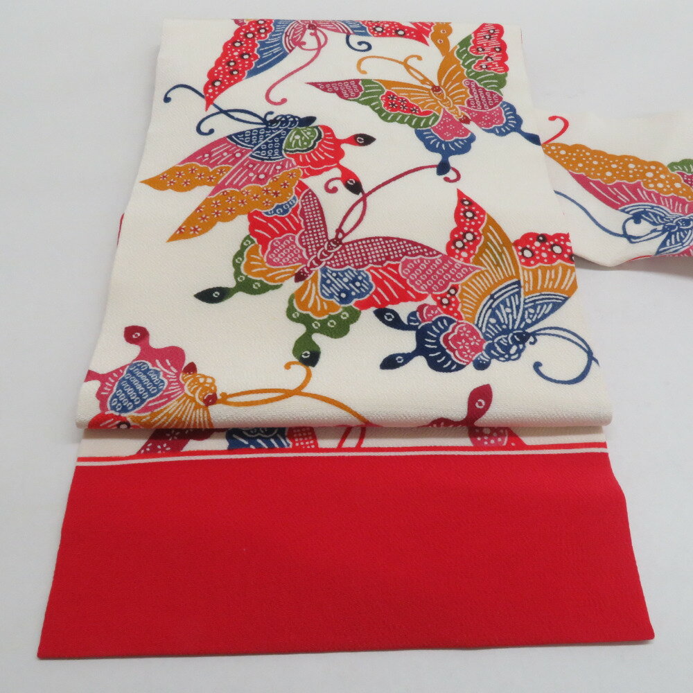 栗山吉三郎 名古屋帯 京紅型 型染 縮緬 揚羽蝶文様 ベージュ色 赤色 全通柄 九寸帯 正絹 仕立て上がり 着物帯 長さ351cm【中古】