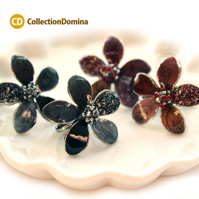 関連商品 お花モチーフアクセサリーは【こちら】 お花モチーフイヤリングは【こちら】 お花モチーフピアスは【こちら】 【イヤリングをすべて見る】 【ピアスをすべて見る】 【ネックレスをすべて見る】 ★ラッピングはこちら★ 商品説明 大ぶりフラワーデザインイヤリングです。 カラー(レッド・ブラック)2色を用意しました！ 耳たぶに直接つけられるタイプなのが魅力！ 金具が見えにくいので、ピアスを着用してる かのように見えるところが嬉しいです。 イヤリング台座はネジバネ式ですので 挟む力を調節できます。 素材 真鍮、ラインストーン サイズ ●フラワーモチーフデザインのサイズ ：約2.3cm×2.4cm ●全体のサイズ(金具先端からTOP先端まで) ：約2.3cm×2.4cm カラー ●レッド　●ブラック重さ片方の重さ：約5.9gその他過度な力を加えると壊れる恐れがございます。商品写真はできる限り実物の色に近づけるよう努力しておりますが、お客様がご使用になられるパソコンのモニターやカラー設定・お部屋の照明・日光などにより色の変化が感じられる場合がございます。 予めご理解いただきますようお願い致します。素材の特性上多少のキズ・カケ等がある場合がございます。用途 母の日　クリスマス バレンタイン　パーティ　普段使い　カジュアル デイリー　誕生日プレゼント 友達 女友達 ギフト 女子 彼女 母 女性 雑貨 小物 30代 40代 50代 人気 おしゃれ ユニーク ポイント消化 楽天新作商品はこちらから特集ページはこちらから