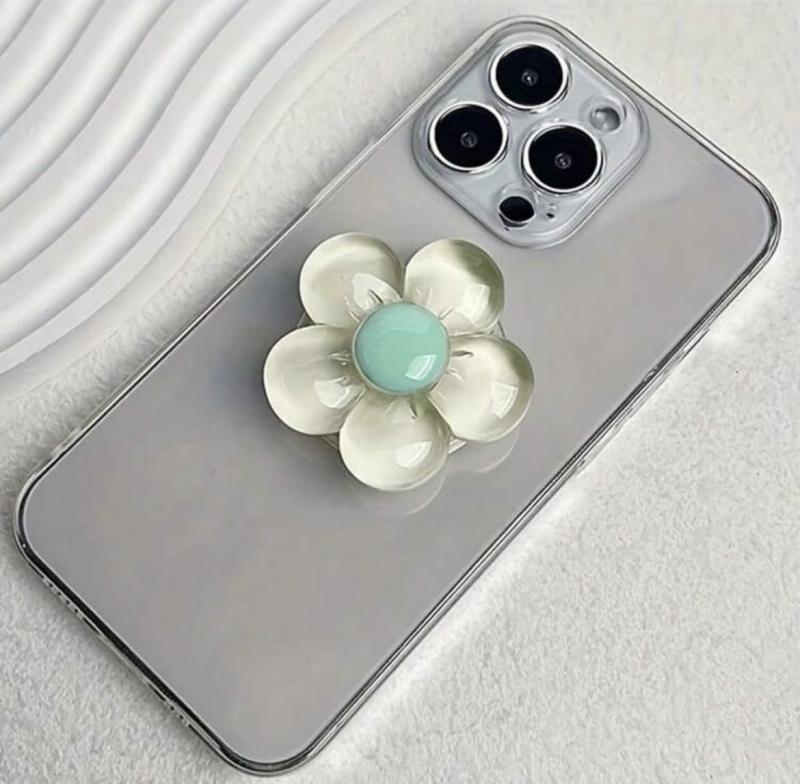 透明フラワー スマホグリップ スマホホルダー スマホスタンド スマホグリップトック ポップソケット スマホリング スタンド ホルダー 韓国 グリップトック 女子 花 パステル ぷっくり アク透明感たっぷりのぷっくりとしたお花モチーフがかわいいスマホグリップ🌸 指にフィットして持ちやすく、落下防止に役立つのはもちろん、スタンドとして立てかければ動画視聴やビデオ通話も快適に楽しめます。 シンプルなスマホケースにも映えるおしゃれなデザイン。 クリア素材をベースにしているため、スマホ本体やケースのデザインを邪魔せず、ナチュラルに使えるのも嬉しいポイントです。 日常のコーデや気分に合わせて選べるので、普段使いはもちろん、プレゼントにもおすすめ。可愛さと実用性を兼ね備えた人気のお花グリップで、毎日のスマホライフをもっと楽しく彩りましょう。