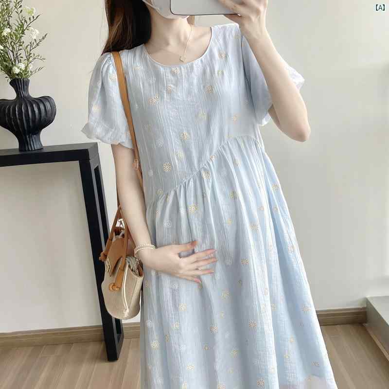 クリエイティブグローバルのワンピース マタニティ レディース 妊婦服 ゆったり 大きいサイズ 体型カバー 半袖 ひざ丈 裾フレア 小花柄 デイジー柄 Aライン 着痩せ プラスサイズ 伸縮性 通気性 カジュアル きれいめ おしゃれ お出かけ 普段着 産前 産後 ママコーデ 春夏 柔｜アングル2